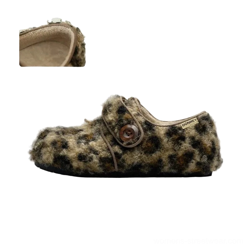 Leopard print fuzzy fleece Mary Jane slippers with rounded closed toe, decorative button strap, plush upper, and thick casual outsole