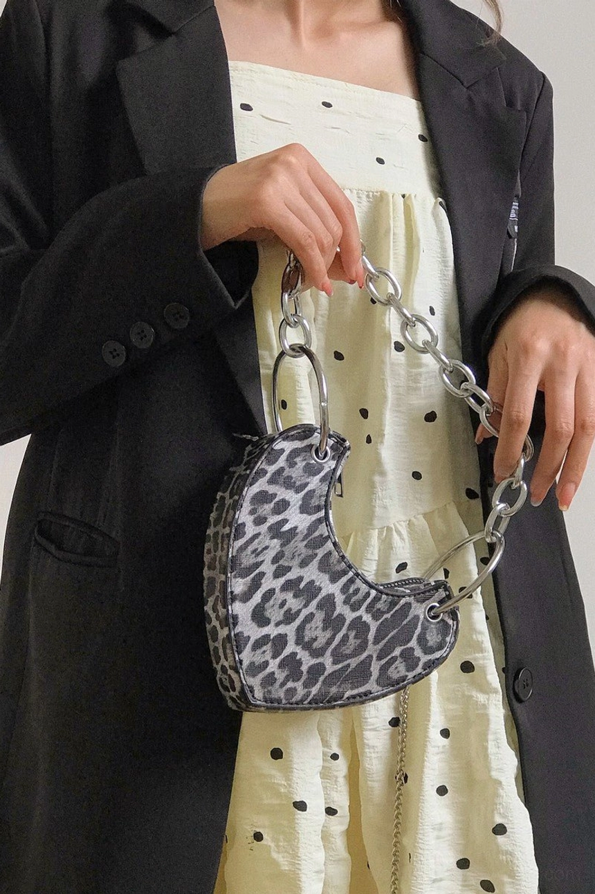 Leopard print heart-shaped mini chain bag held with black blazer streetwear outfit