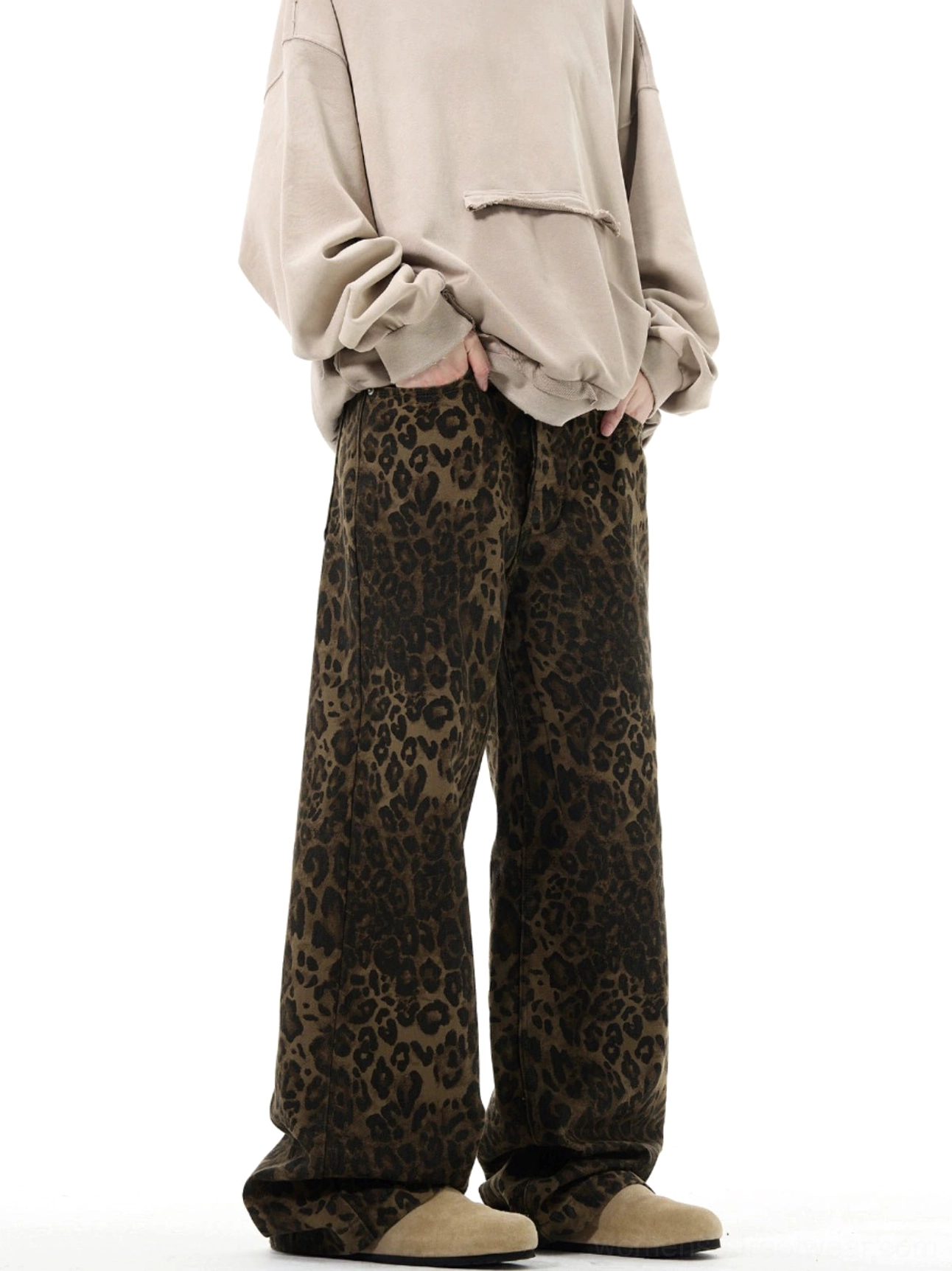 Leopard print high-waist wide-leg streetwear trousers front three-quarter view styled with an oversized beige hoodie