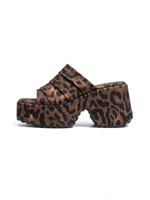 Leopard ruched platform slide sandals shown in a side studio view with open square toe, chunky black platform sole, and bold animal print upper