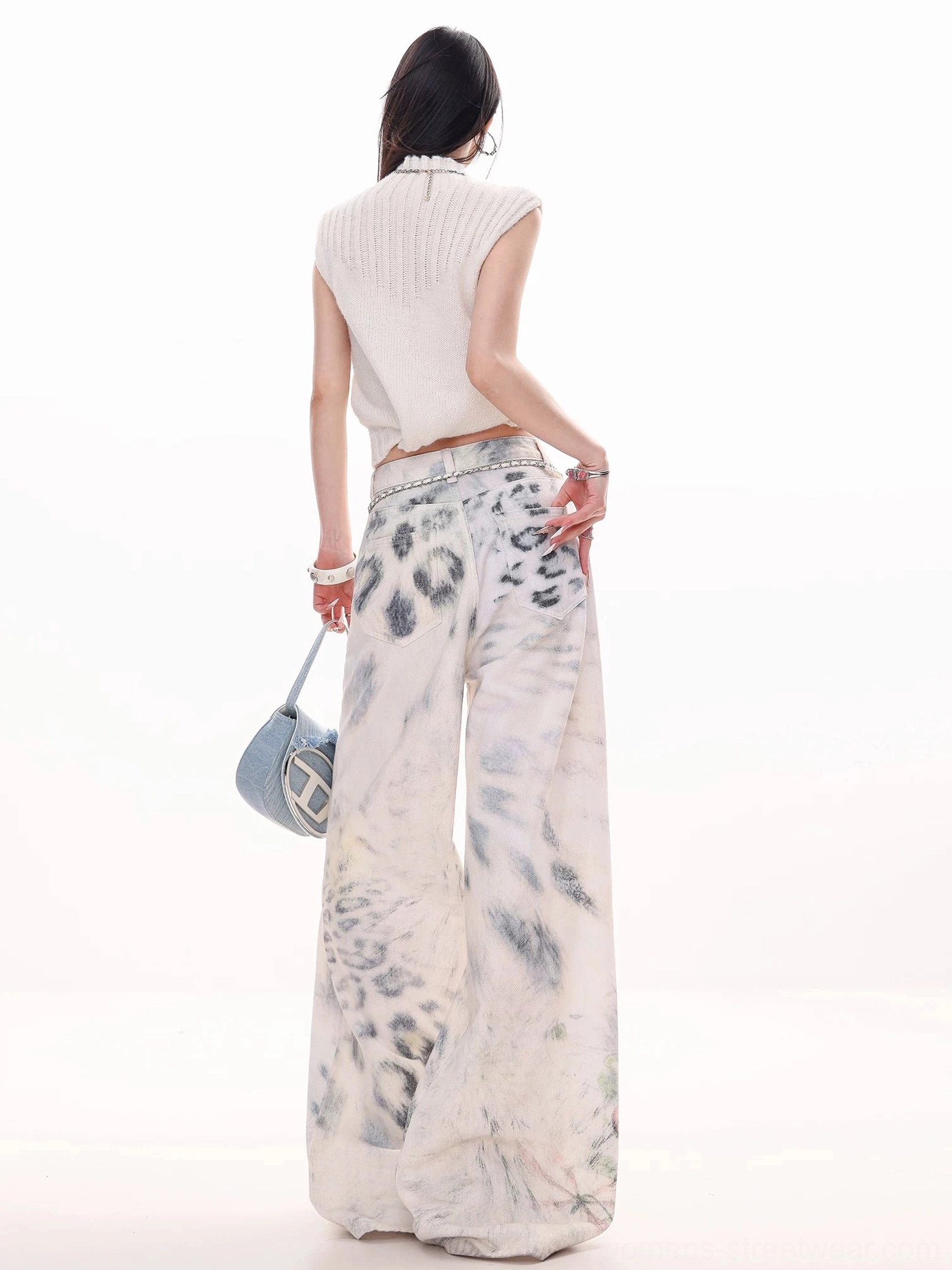 Back view of off-white leopard tie-dye wide-leg jeans with full printed coverage and a relaxed Y2K streetwear silhouette