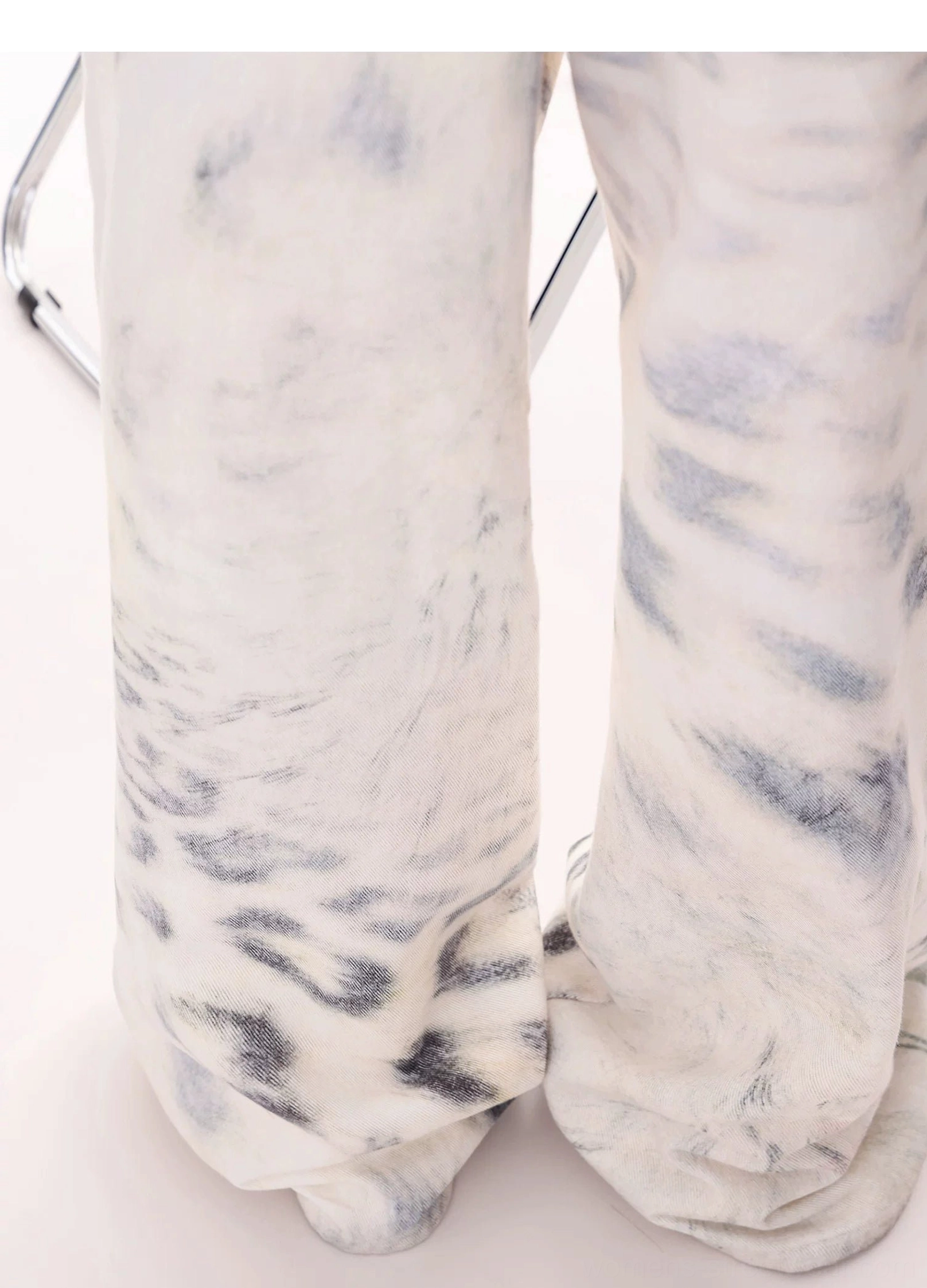 Leopard tie-dye wide-leg jeans fashion detail image featuring the loose silhouette, washed finish, and Y2K streetwear aesthetic
