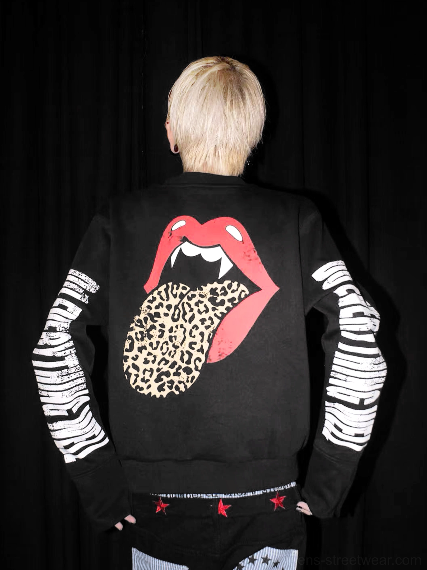 Back studio view of black streetwear crewneck with large red lips fangs and leopard print tongue artwork