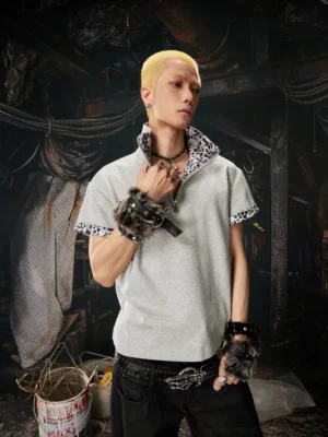Gray boxy half-zip polo shirt with leopard print collar and cuffs on male streetwear model side view