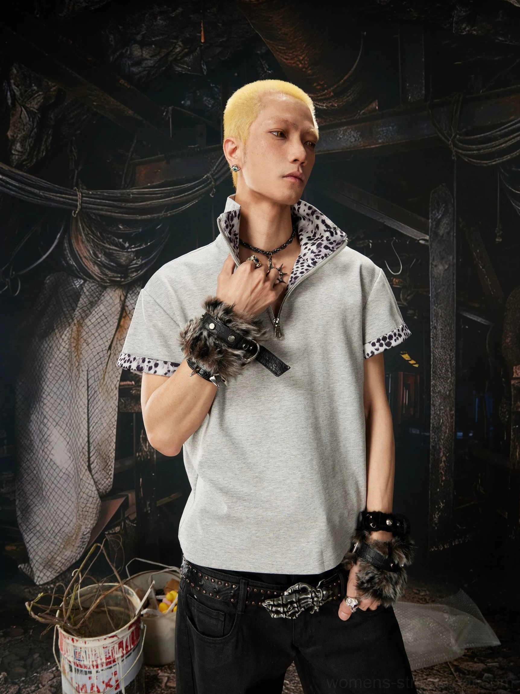 Gray boxy half-zip polo shirt with leopard print collar and cuffs on male streetwear model side view