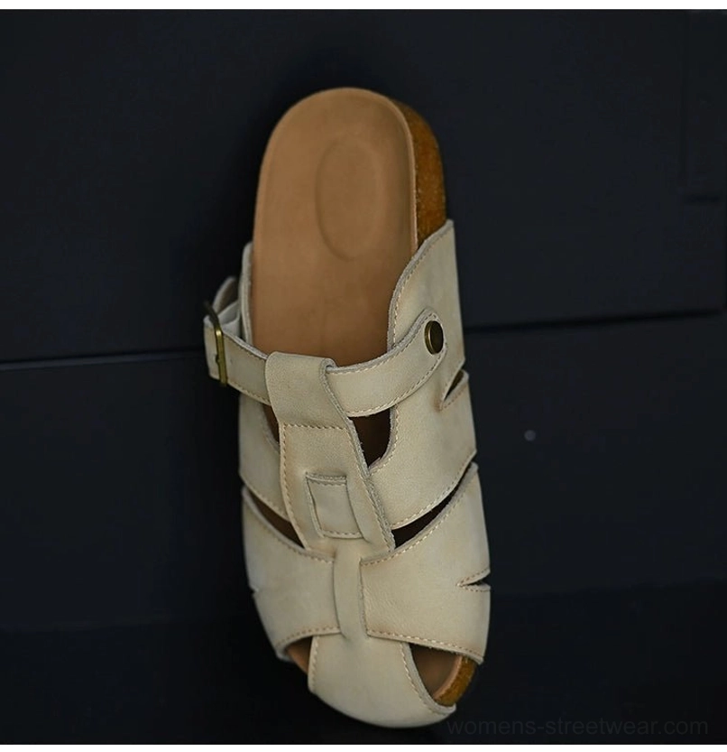 Light beige leather fisherman sandals featuring a closed rounded toe, breathable woven upper, adjustable side buckle, and natural cork-style midsole