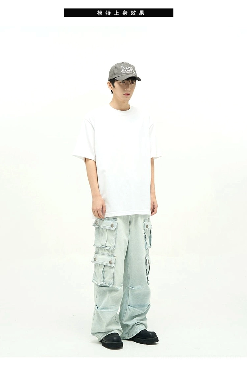 Relaxed light blue cargo jeans styled with a white T-shirt, baseball cap, and glasses, highlighting the unisex urban streetwear fit