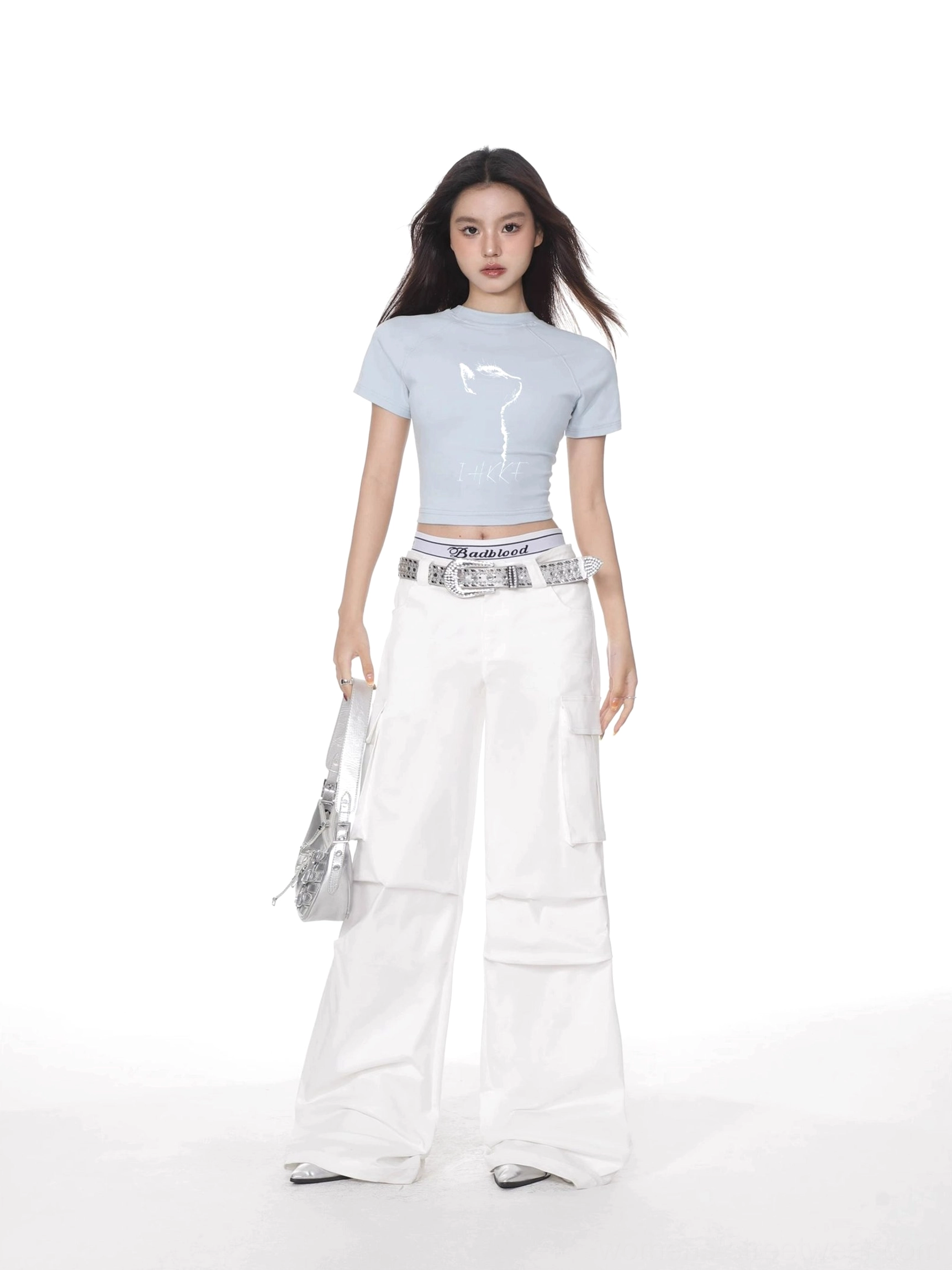 Pastel light blue cat print cropped fitted short sleeve t-shirt styled with white wide leg cargo pants