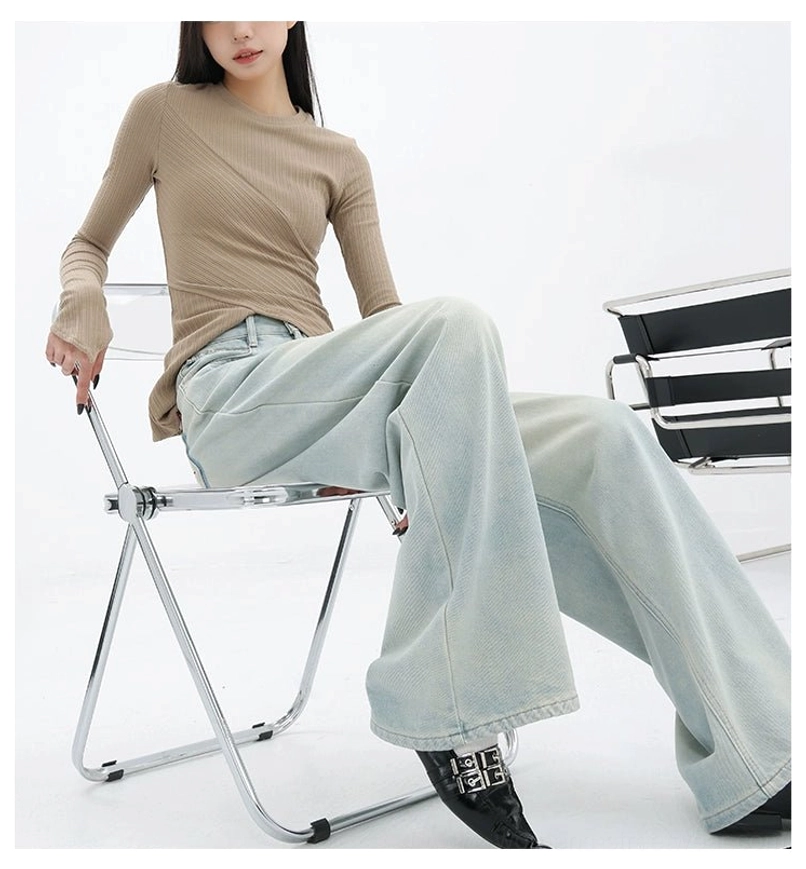 Light blue embroidered denim jeans with a high-rise waist and oversized wide-leg shape for casual outfits