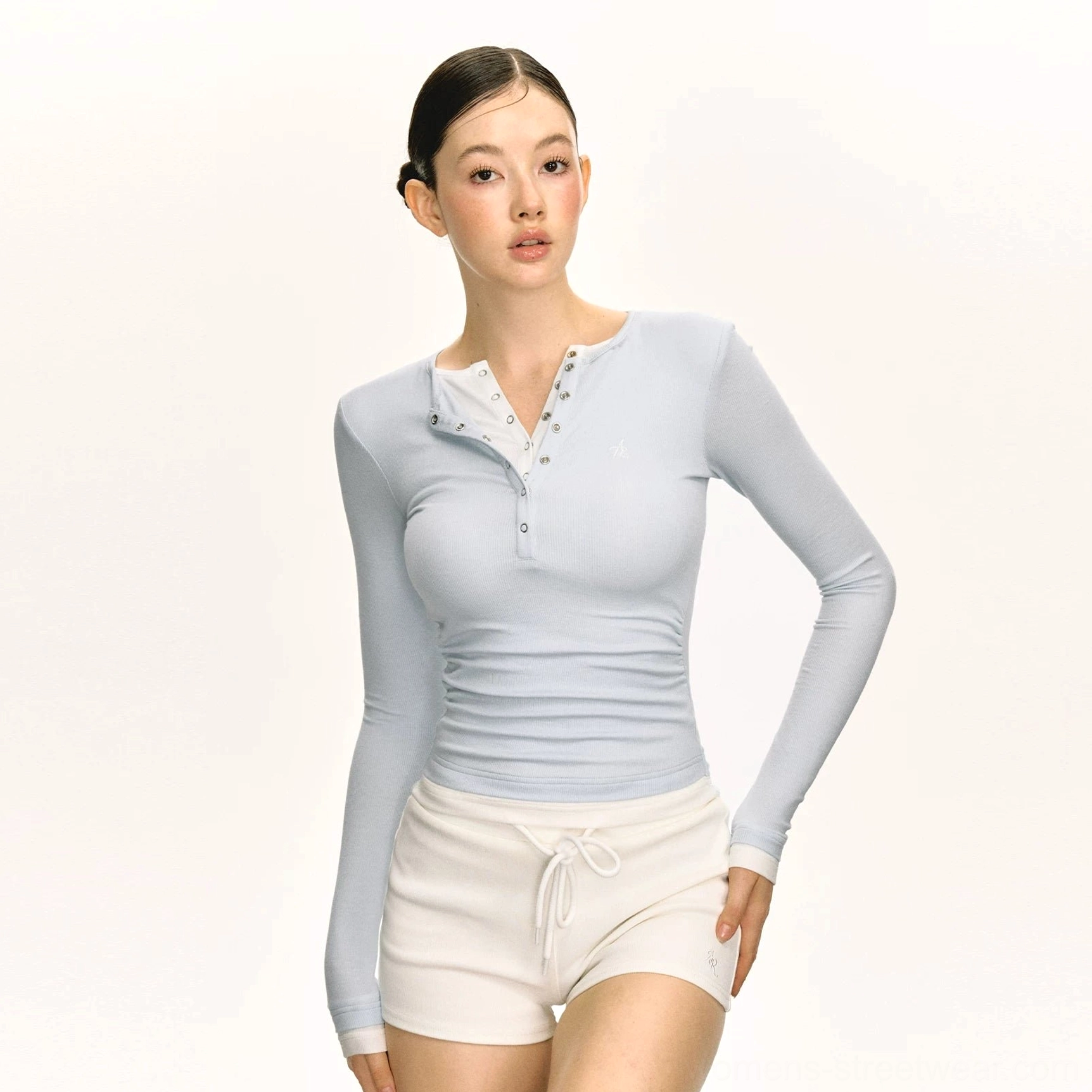 Light blue fitted layered Henley ribbed long sleeve streetwear top styled with white drawstring shorts