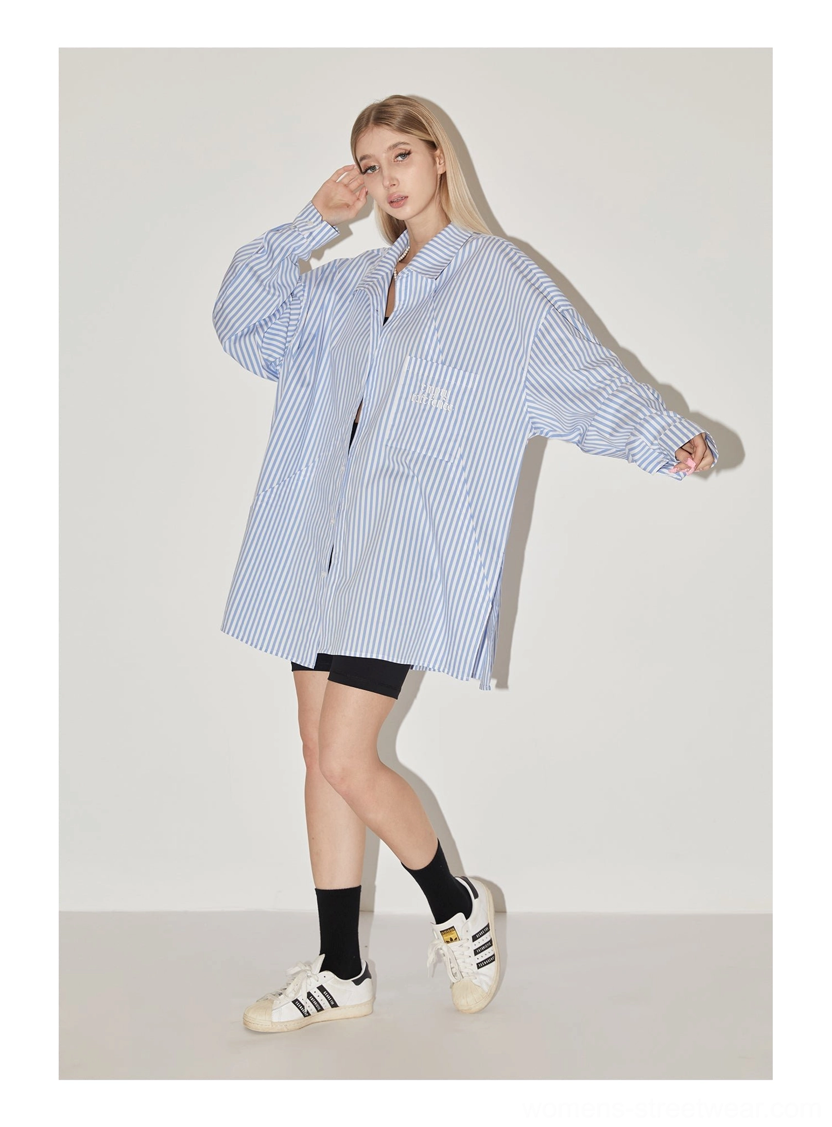 Light blue striped geometric panel oversized streetwear shirt button-front design detail