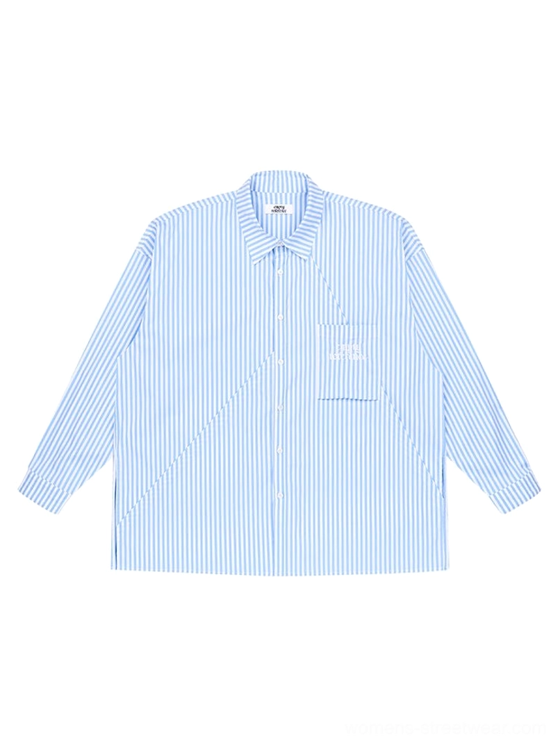 Light blue geometric panel striped oversized streetwear shirt flat lay front view with button closure and large chest pocket