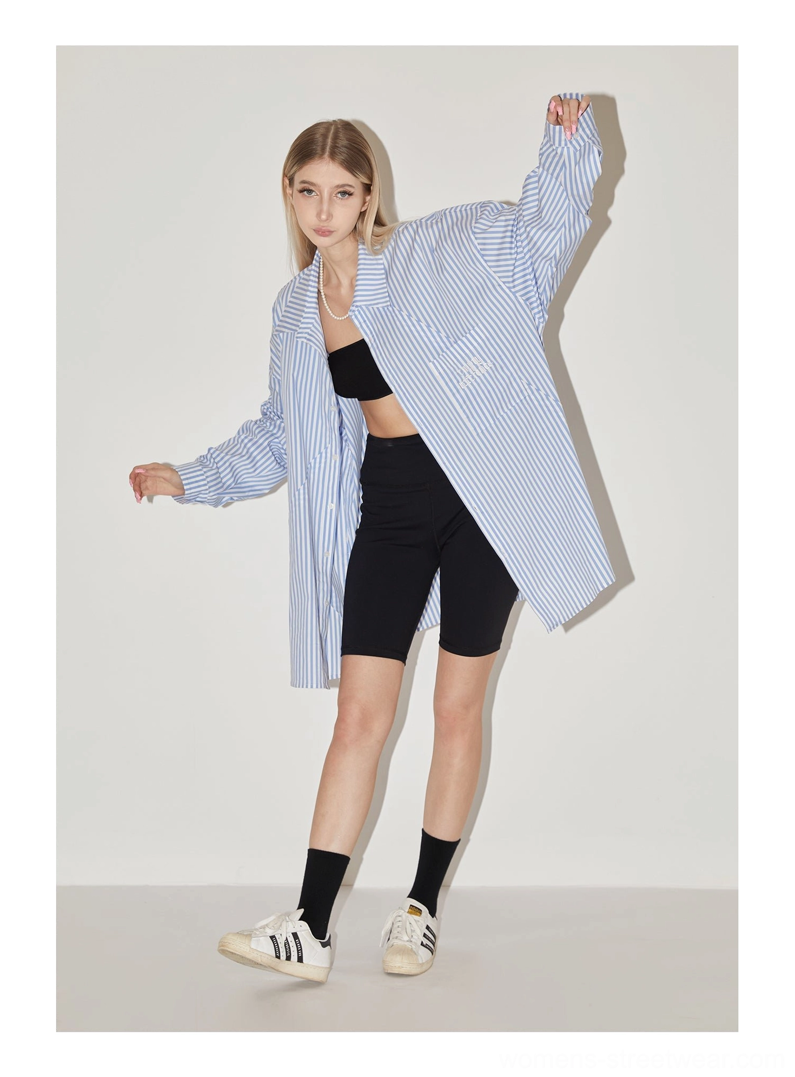 Light blue geometric panel striped oversized shirt with diagonal stripe construction and chest pocket