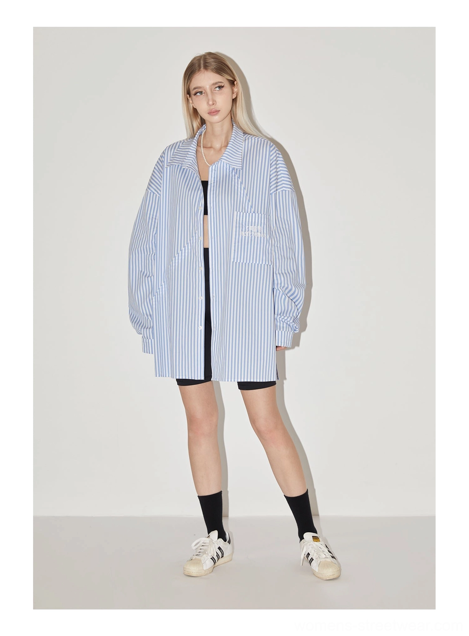 Light blue geometric panel striped oversized shirt showing relaxed Seoul streetwear silhouette