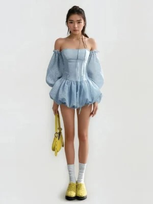 Light blue gingham puff sleeve mini romper dress with off shoulder neckline, ruffled bubble hem, yellow shoulder bag and platform loafers in Korean streetwear styling