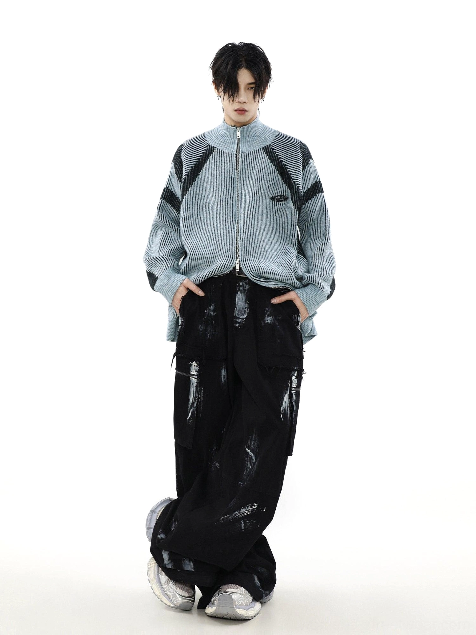Low-angle view of a light blue high-neck oversized knit cardigan with contrast stripes and full-zip Korean fashion styling