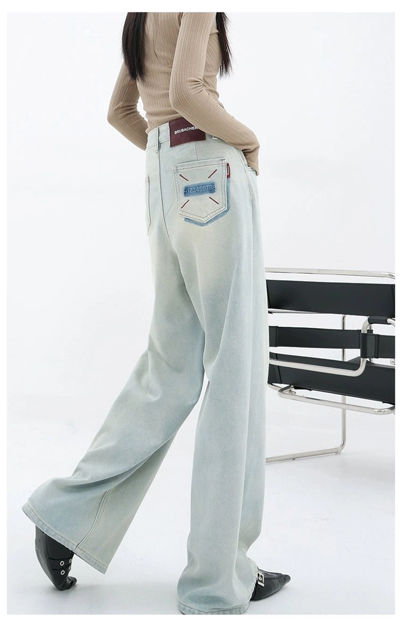Light blue high-rise denim jeans with a loose silhouette for Y2K streetwear and modern casual styling