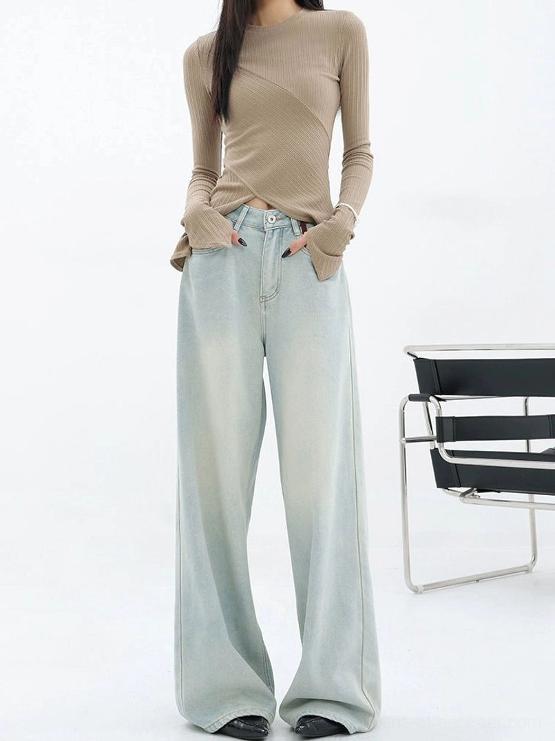 Front full-body view of light blue high-rise full-length wide-leg jeans with a soft faded wash