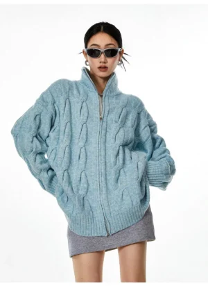 Light blue cable knit zip-up cardigan oversized relaxed fit front facing full body streetwear style