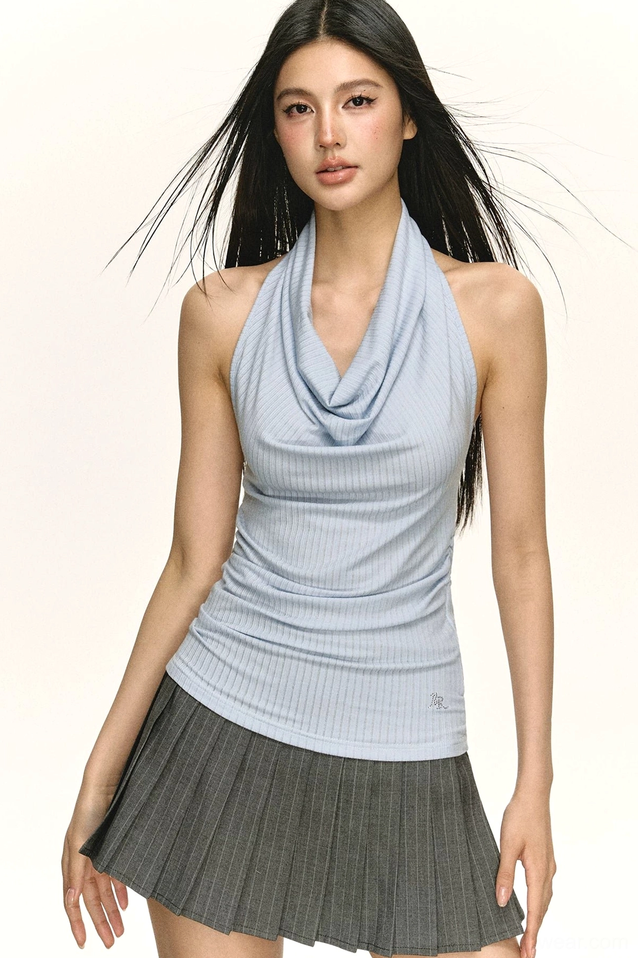 Front view of a light blue slim fit cowl neck halter top with sleeveless styling and a softly draped neckline