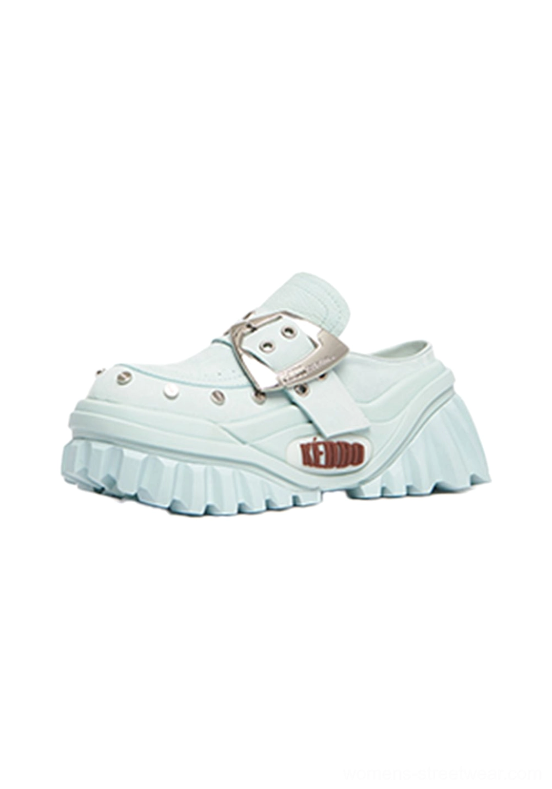 Light blue studded buckle platform mule shoes shown from a three-quarter angle with chunky ridged rubber sole and statement streetwear design