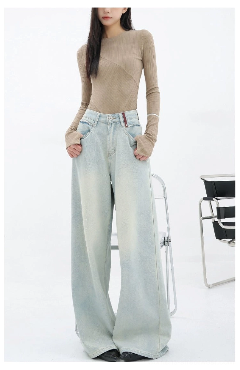 Light blue wide-leg embroidered denim pants styled for Acubi-inspired and East Asian street fashion