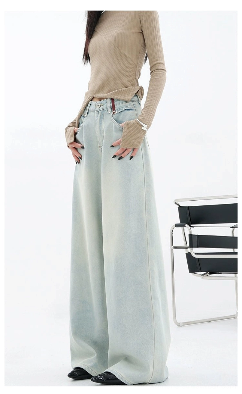 Light blue wide-leg jeans for women styled as versatile everyday streetwear pants with a vintage faded wash
