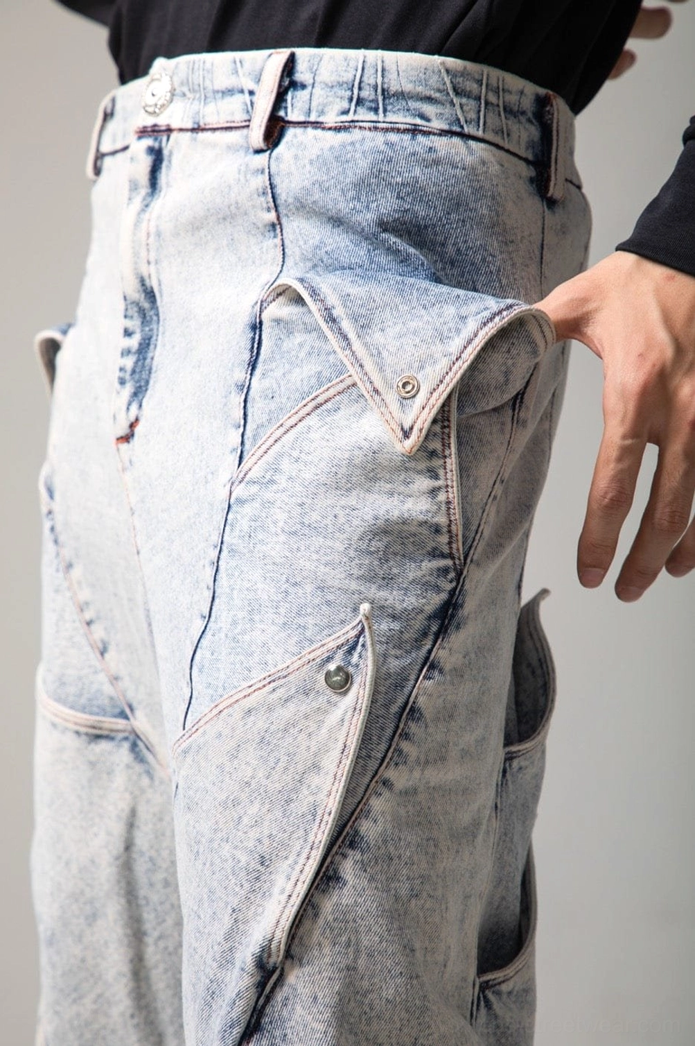 Light blue wide leg shark fin jeans with sculptural denim panels and relaxed Korean streetwear silhouette