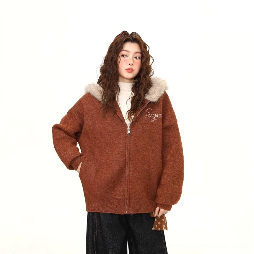 Full-body styling view of the light brown faux fur trim zip hoodie jacket paired with dark pants and a decorative scarf