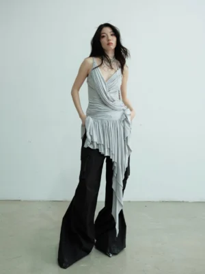 Light gray asymmetric draped camisole top with ruched bodice, spaghetti straps, and long pleated fringe hem