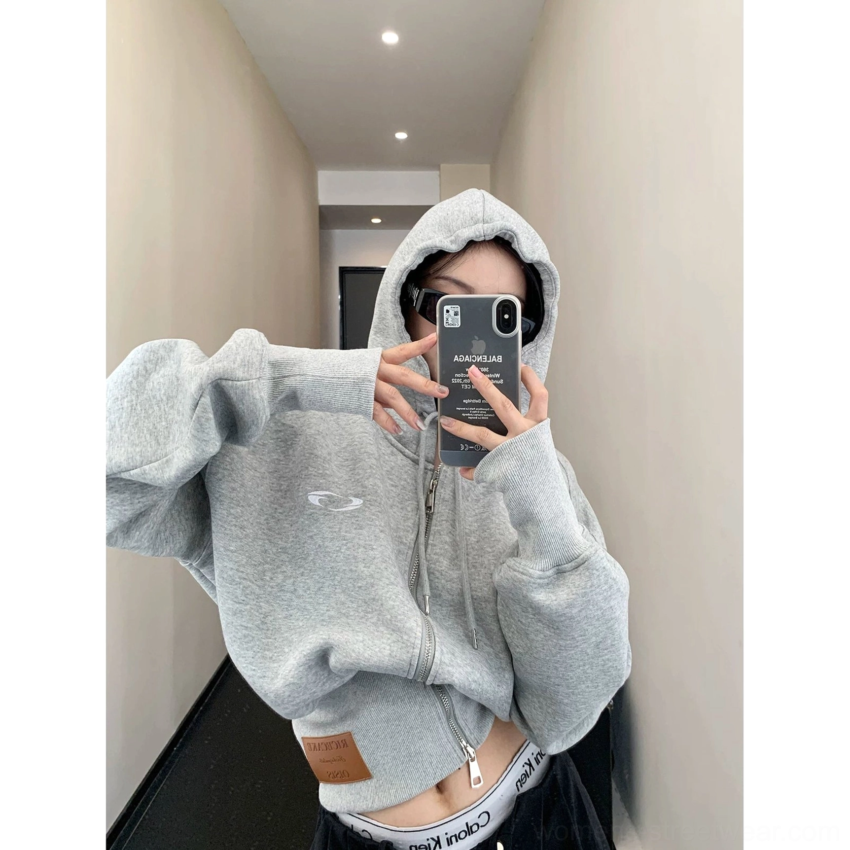 Light gray oversized cropped zip hoodie with soft fleece construction, dropped shoulders, roomy sleeves, ribbed hem, and Korean streetwear styling