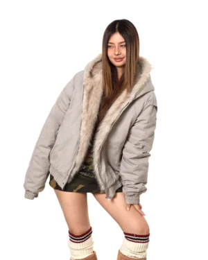 Light gray oversized faux fur-lined bomber jacket shown from the side with relaxed Korean streetwear styling, camo mini skirt, and striped socks