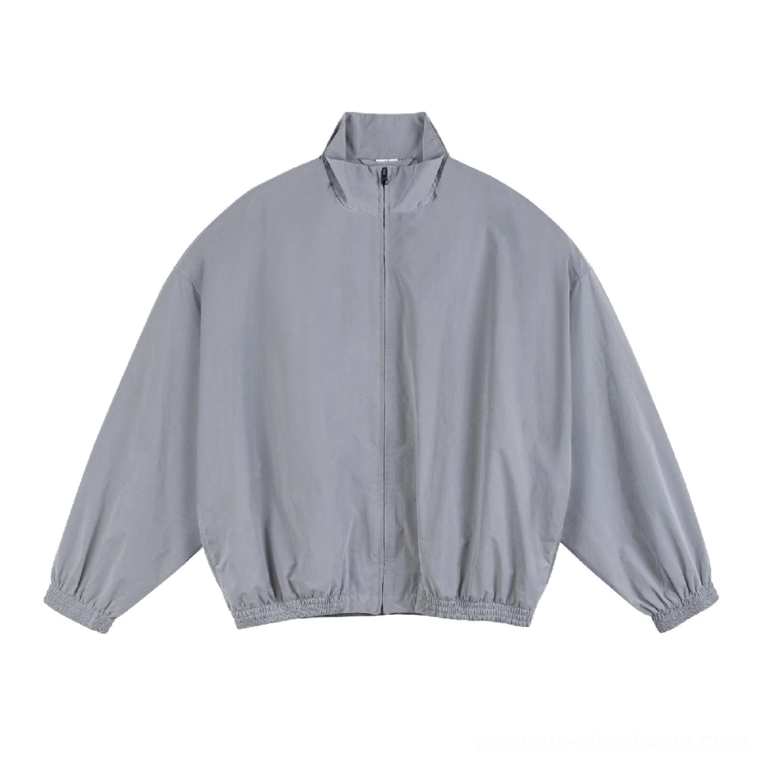 Light gray oversized loose-fit windbreaker jacket with stand collar zipper front and elasticated trims