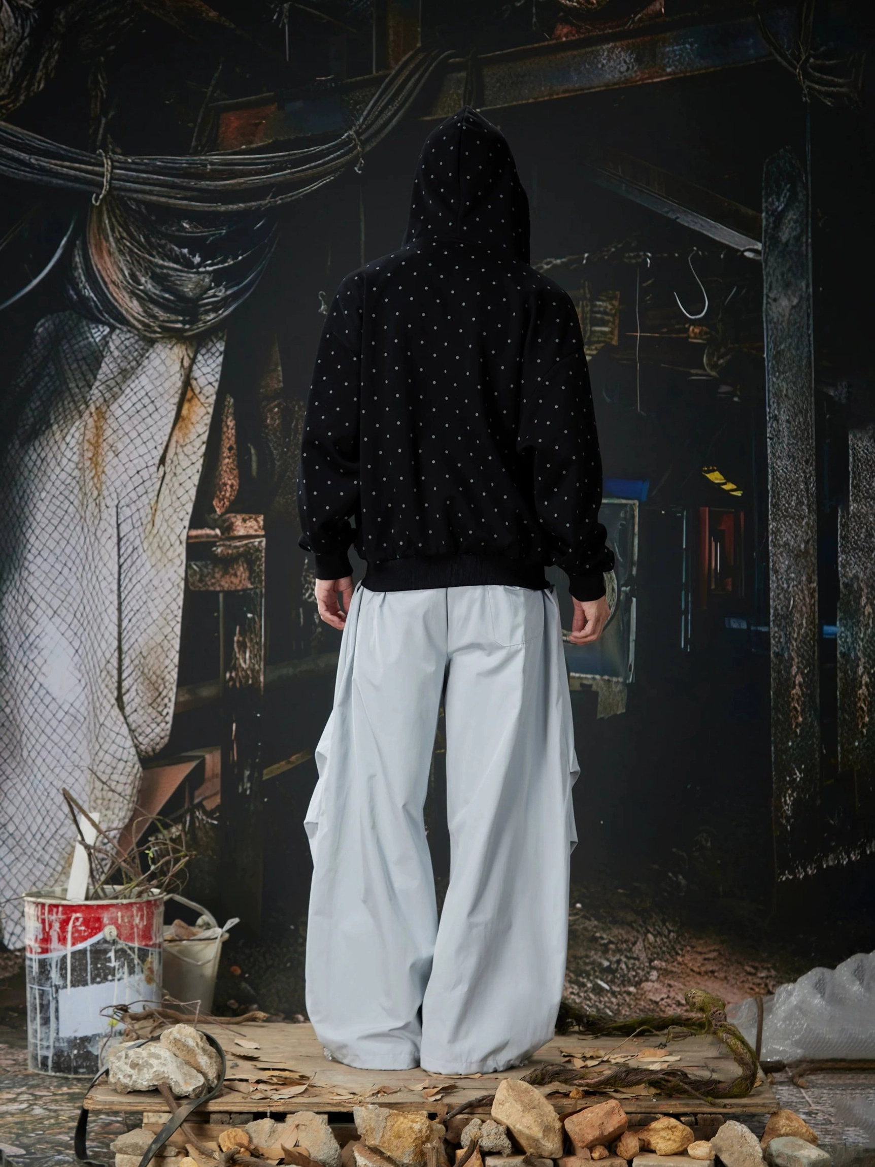 Light gray oversized casual track pants shown from the back with a clean wide-leg silhouette and contemporary Korean streetwear styling