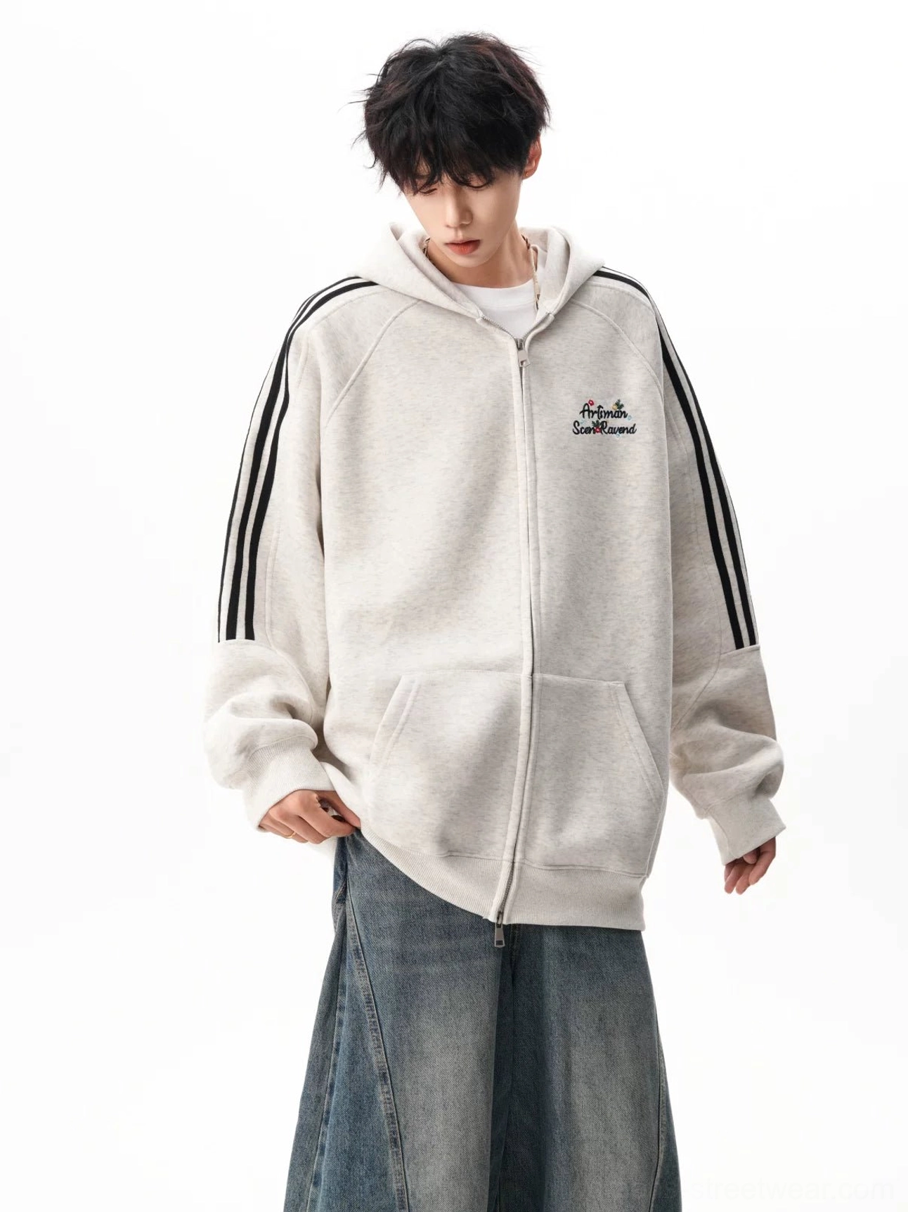 Light gray oversized zip-up hoodie with contrasting black shoulder stripes, embroidered chest detail, and relaxed casual streetwear fit