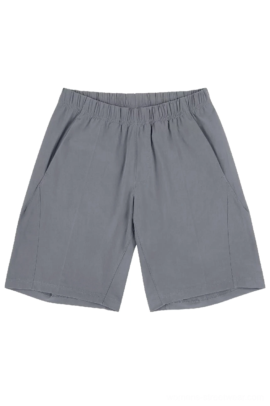 Front flat lay of light gray quick-dry tech shorts with elastic waistband, slanted side pockets, and tailored seams