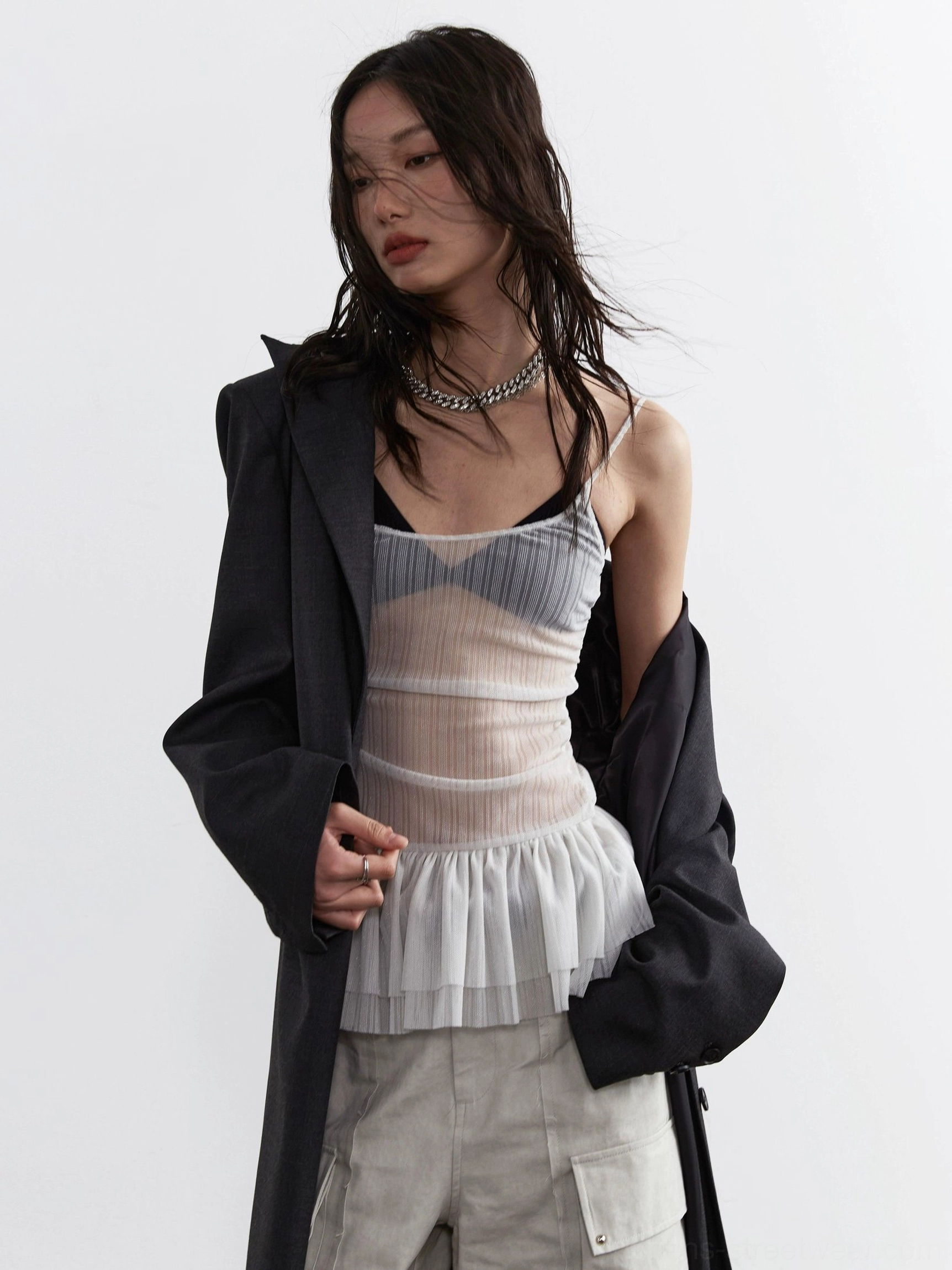 Front medium view of light gray sheer pleated bustier corset top with square neckline and tulle peplum waist detail