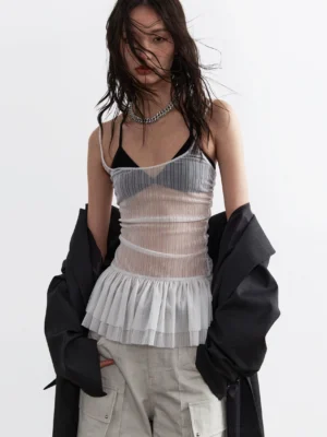 Light gray sheer pleated corset top with tulle peplum styled with black blazer and gray cargo shorts front view