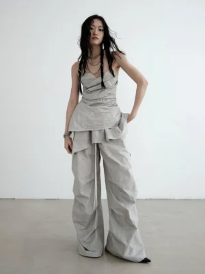 Light gray strapless ruched asymmetric draped top styled with wide-leg cargo pants in a full front streetwear outfit