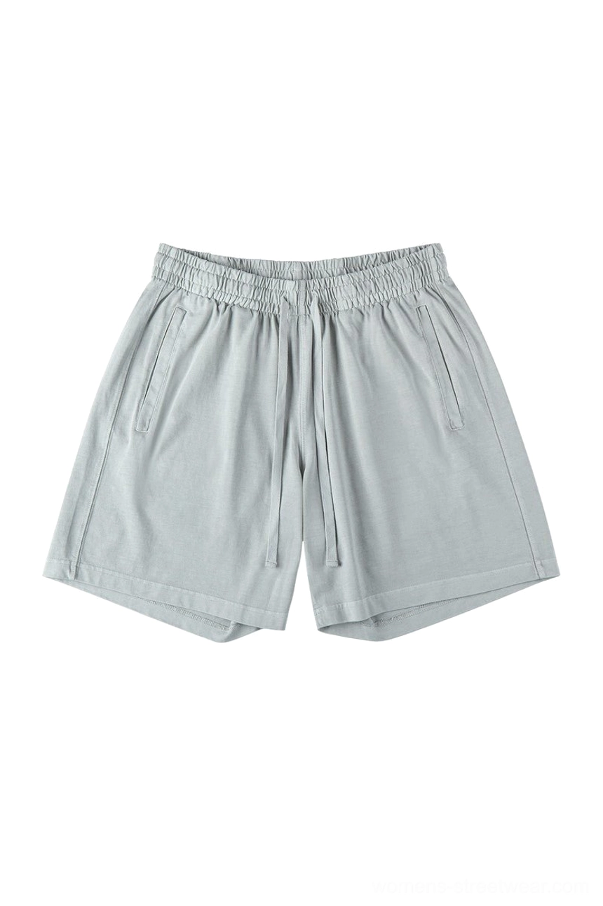 Light gray washed cotton streetwear shorts with soft texture elastic waistband adjustable drawstring and relaxed oversized fit