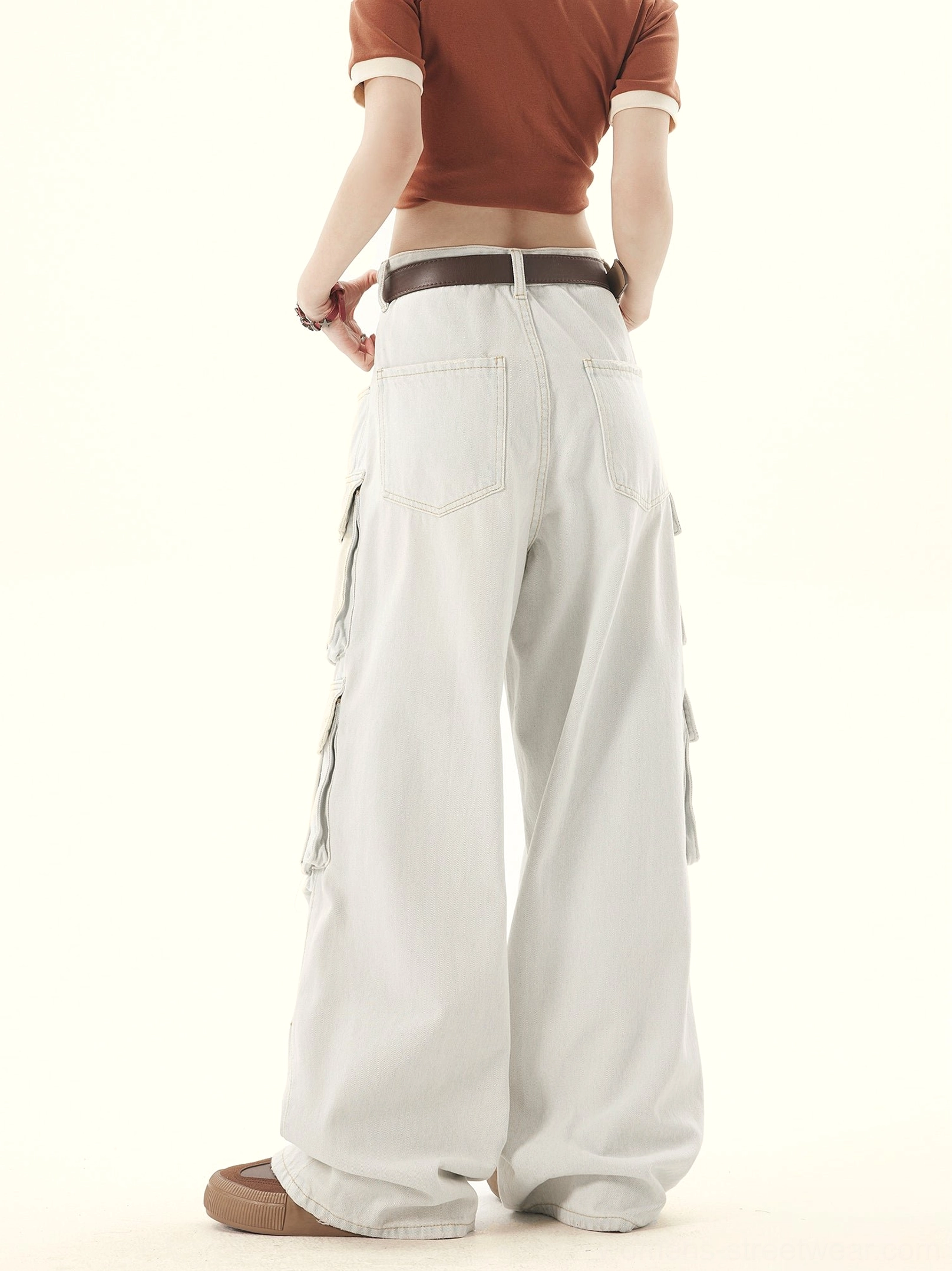 Full back view of light gray washed denim wide leg cargo pants showing back patch pockets and wide hems