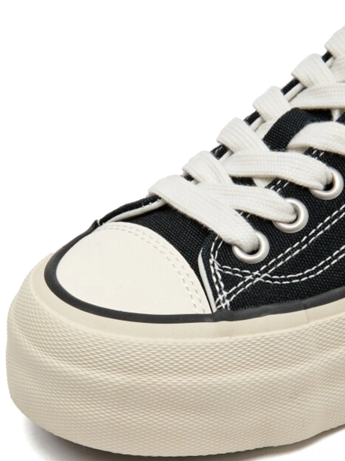 Light green canvas low-top platform sneaker with cork midsole, flat lay product showcase with white rubber toe cap