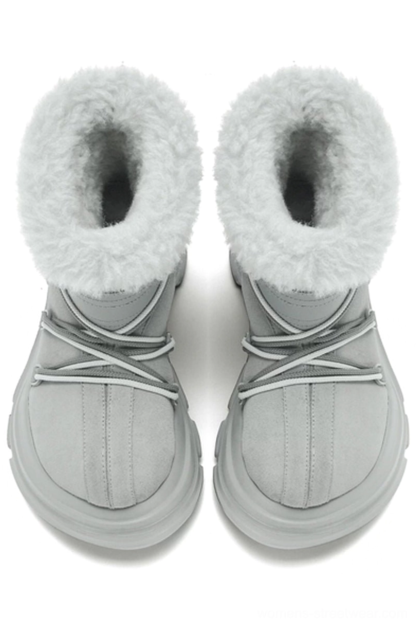 Pair of light grey faux fur winter snow boots from a front top-down view with crisscross drawstrings, split toe caps, and chunky soles