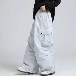 Light grey oversized cargo snow pants with relaxed wide-leg silhouette and flap cargo pockets for winter streetwear