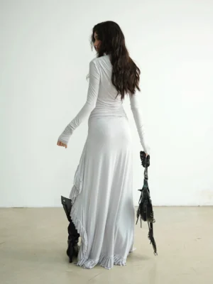 Back view of a light grey fitted off shoulder maxi dress with ruched detailing and a floor length asymmetric silhouette