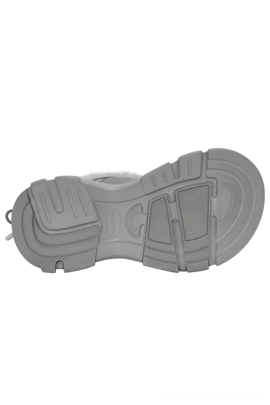 Light grey chunky lug outsole detail for winter snow boots showing the heavy-duty tread pattern and textured platform construction