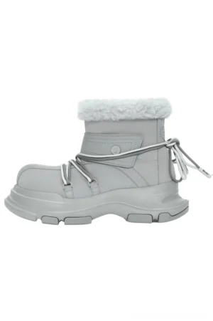 Light grey winter snow boot in side profile with white faux fur cuff, dual-tone drawstrings, hook-and-loop ankle strap, and chunky lug platform sole