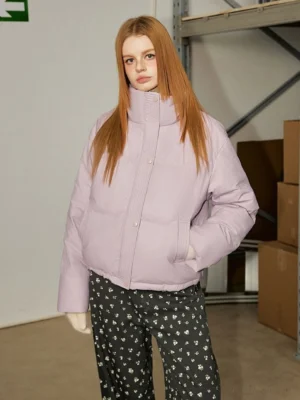 Light purple cropped quilted stand collar puffer jacket shown from the front with relaxed streetwear fit, side pockets, and floral print pants