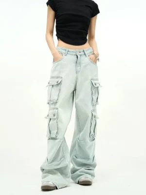 Front view of light blue baggy cargo jeans featuring symmetrical oversized flap pockets, high-waisted fit, and relaxed wide-leg streetwear silhouette