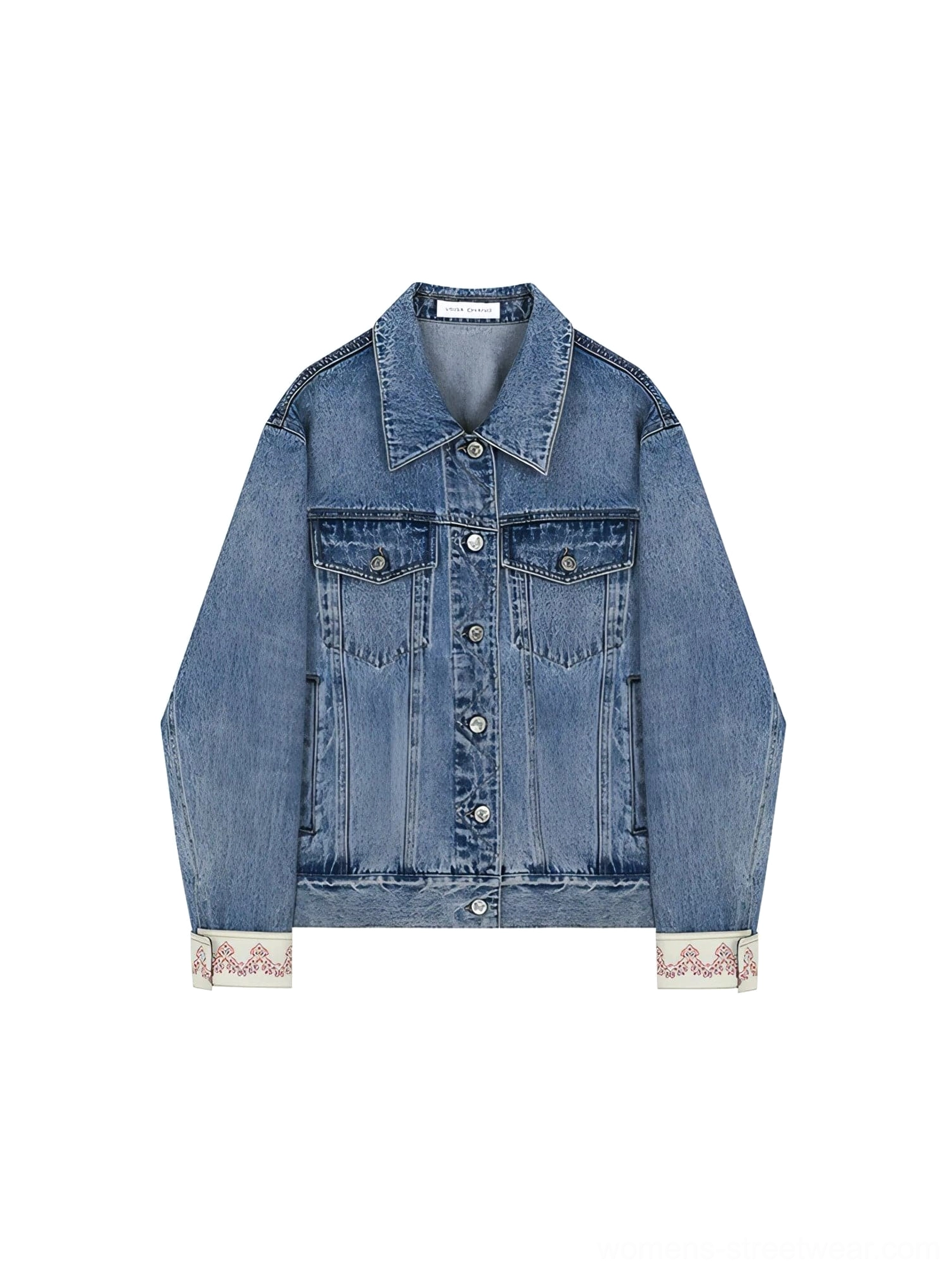Light wash denim trucker jacket displayed flat with dual chest pockets, button front, and embroidered turn-back cuffs